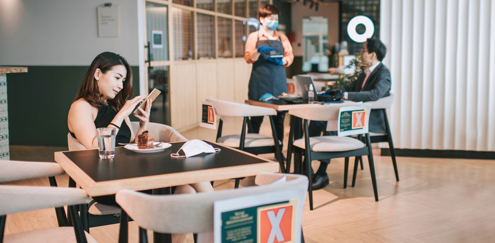 Restaurant with people seated and social distancing